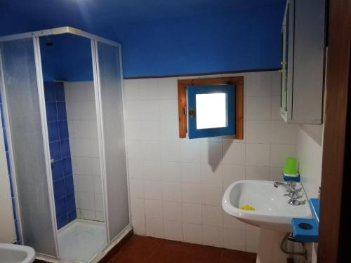 a bathroom with a shower and a sink and a tub at Le Monticelle in Itri