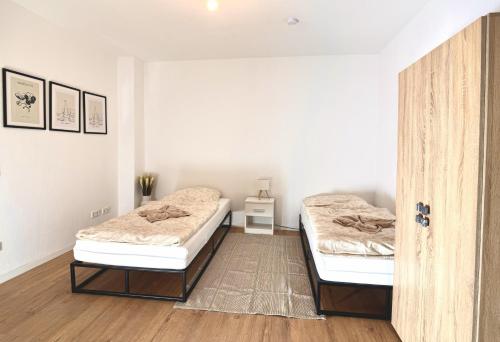 Postel nebo postele na pokoji v ubytování FlexHome Stadtnatur Ferienwohnung