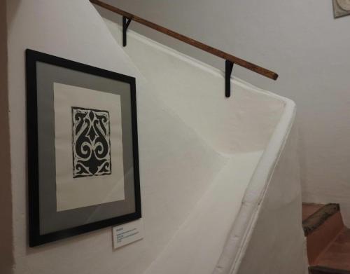 a stairway with a framed picture on a wall at Casa Larralde in Bisimbre