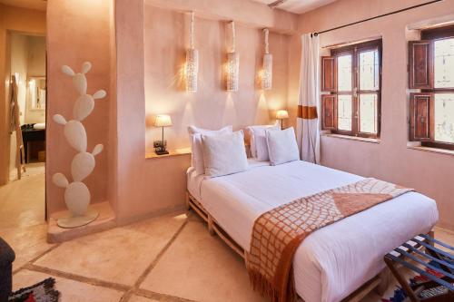 Postel nebo postele na pokoji v ubytování Riad Caravane