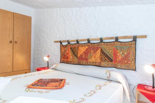 a bedroom with a bed with a blanket on it at Casa Pasqualina in San Giovanni