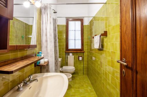 a bathroom with a sink and a toilet at Seaview Camaiore in Camaiore