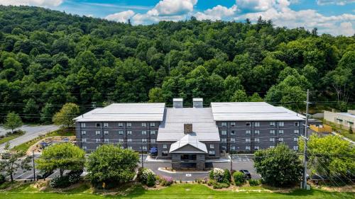 an aerial view of a building in front of a mountain at Graystone Lodge, an Ascend Collection Hotel in Boone