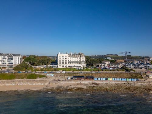 a view of a beach with buildings and the ocean at The Falmouth Hotel in Falmouth