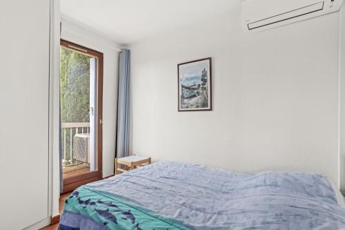 En eller flere senge i et værelse på Appartement Chêne Liège