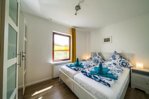 Postel nebo postele na pokoji v ubytování Ferienwohnung Austernfischer