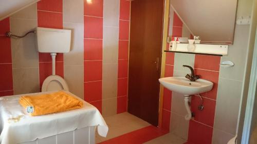 Kúpeľňa v ubytovaní Apartman Denis Una