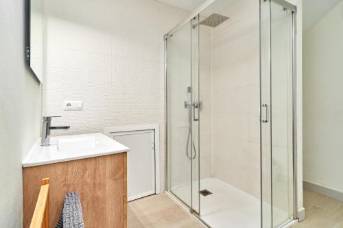 a bathroom with a sink and a shower at Luxury apartment in Nerja in Nerja
