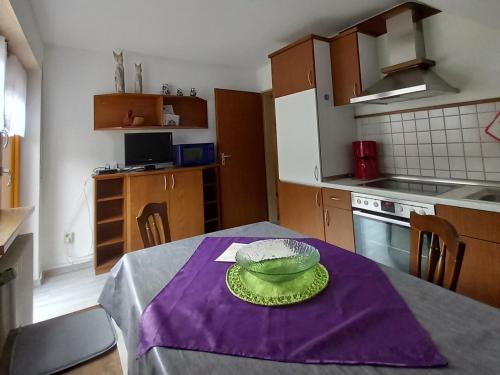 a kitchen with a table with a bowl on it at Ferienwohnung Faller in Elzach
