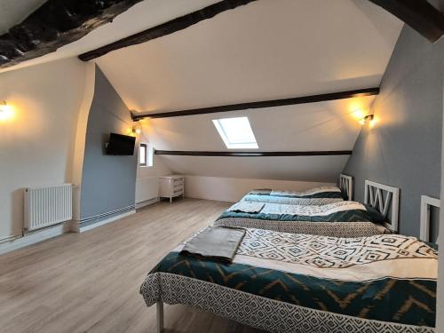 Llit o llits en una habitació de Les petits gaillards