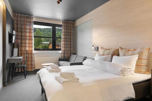 Un ou plusieurs lits dans un hébergement de l'établissement Trysil Hotel