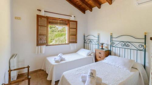 Postel nebo postele na pokoji v ubytování Casa Guajar Monda by Ruralidays