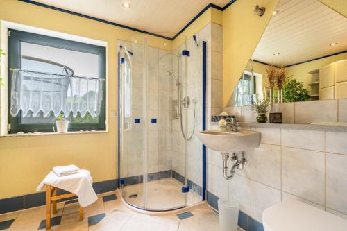 a bathroom with a shower and a sink at Ferienwohnung Erzgebirge in Grünhainichen