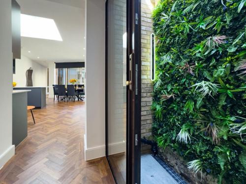 a green wall in a living room next to a door at Escape to Broadstairs in Broadstairs