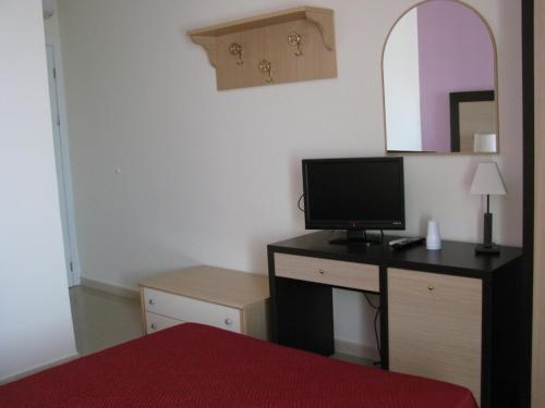 A television and/or entertainment centre at Albergo Roma