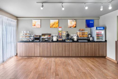 a fast food restaurant with a counter with food at Comfort Inn East in Sudbury
