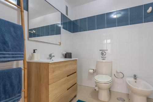 a bathroom with a toilet and a sink at Apartamento Los Alisios in Punta del Hidalgo