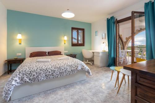 En eller flere senge i et værelse på Villa Amistad