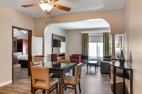 a living room and dining room with a dining table and a living room at Comfort Suites St Charles-St Louis in St. Charles