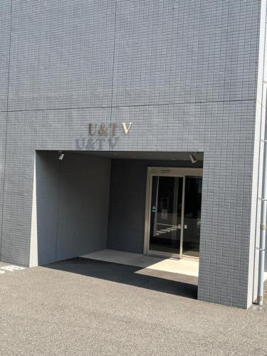 an entrance to a building with a revolving door at U&T V-Five Room-306 in Beppu