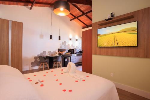 Una cama o camas en una habitación de Pousada Vinháticos