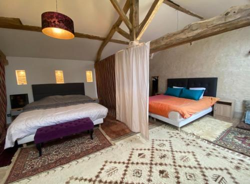 Ένα ή περισσότερα κρεβάτια σε δωμάτιο στο La Grange des zarts