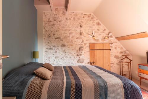 En eller flere senge i et værelse på Le Theureau B&B