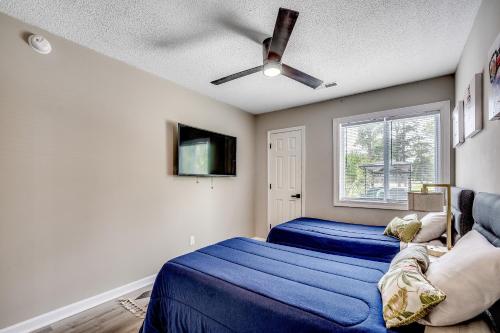a bedroom with two beds and a ceiling fan at Modern Updated Elite 3BR Beach Home! Close to Golf Course & Beach! in Myrtle Beach