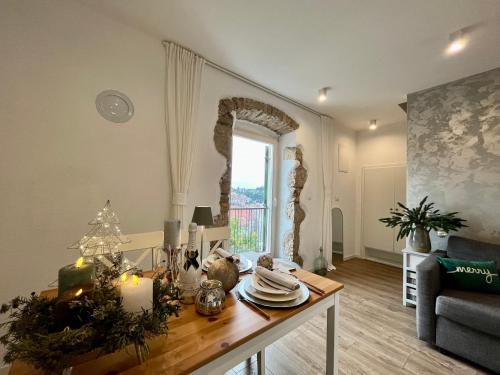 a living room with a table with christmas decorations at Casa Rustica in Mali Lošinj