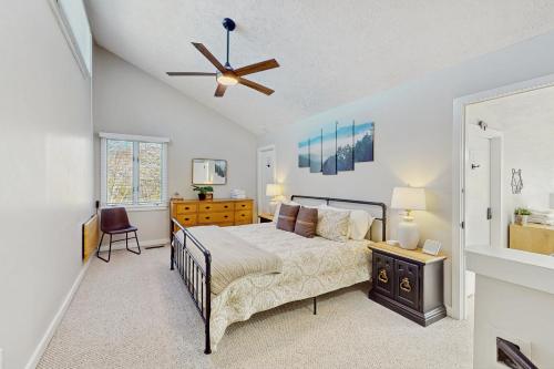 a bedroom with a bed and a ceiling fan at The Glen C10 in Sugar Mountain