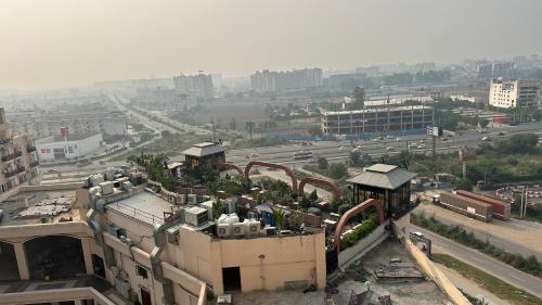 a view of a city with buildings and a highway at Luxe Homes 1Bhk Luxury AirB&B Flat in Mohali
