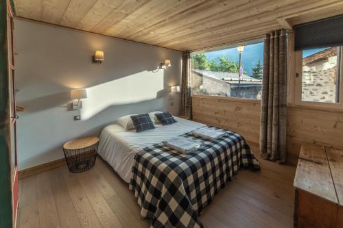 Postel nebo postele na pokoji v ubytování Chalet Familial Meribel 1600