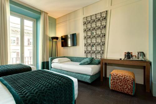Postel nebo postele na pokoji v ubytování Mascagni Luxury Rooms & Suites