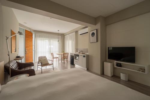 Postel nebo postele na pokoji v ubytování Xi Tou in Sunny Day Inn