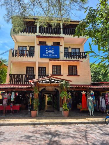 a building with a store in front of it at Hotel Casa el Moro in Puerto Morelos