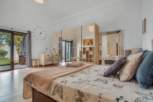 a bedroom with a large bed with a large mirror at Villa Sosha - Carpe Mundi in La Oliva