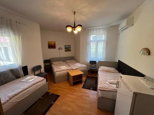 Postel nebo postele na pokoji v ubytování Korona Villa