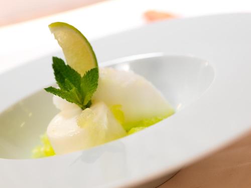 a bowl of ice cream with a lime on top at Hotel Bütgenbacher Hof in Butgenbach