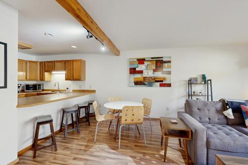 a living room with a couch and a table at Pineridge Patio in Big Sky