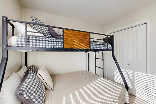 a bedroom with two bunk beds in a room at Morning Sun 2061B in Big Sky