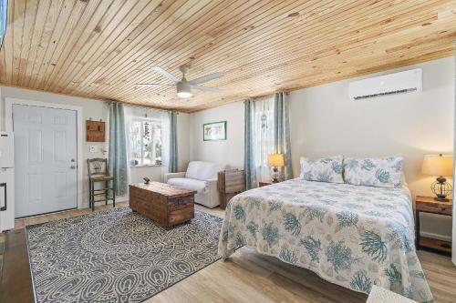 a bedroom with a bed and a living room at Terrapin Station I in Chicken Island