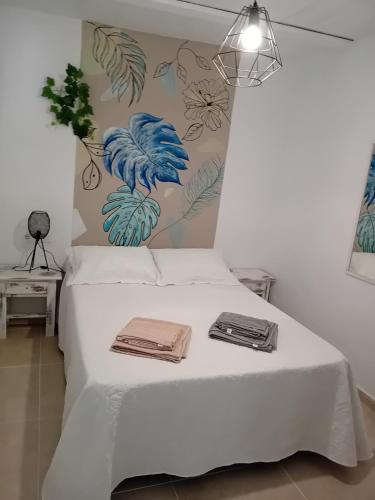 En eller flere senge i et værelse på El Olivo