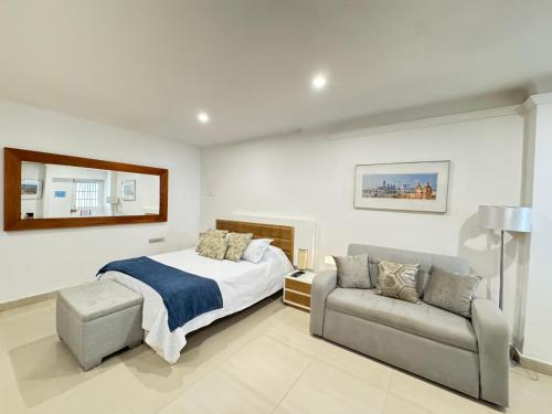 Ένα ή περισσότερα κρεβάτια σε δωμάτιο στο Hermoso apto estudio en la ciudad amurallada!