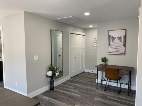 a hallway with a table and a mirror at The Fallviews at Burdett Falls in Burdett