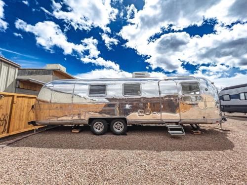 an old rv parked in a parking lot at Desert Dream Airstream in Tombstone