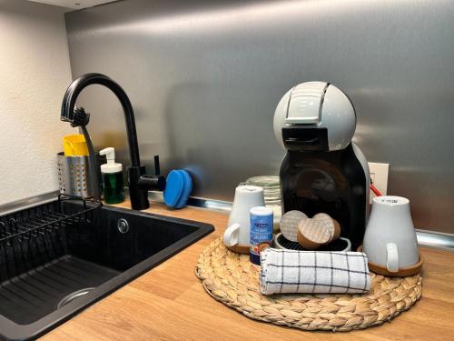 a coffee maker sitting on a counter next to a sink at Golf del Sur GreenPark apartments with pool Corbeta 118 in San Miguel de Abona
