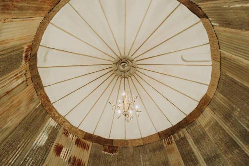 a ceiling in a building with a chandelier at Hub City Silos in Doud