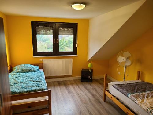 Postel nebo postele na pokoji v ubytování Ihr Zuhause auf Zeit