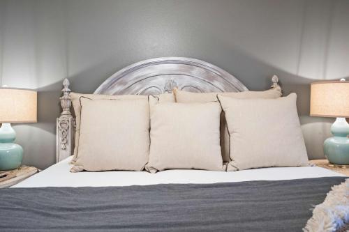 a bedroom with a bed with pillows and two lamps at Par 7 Penthouse at StoneBridge Resort in Branson West