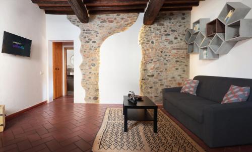 a living room with a couch and a table at Casa Castello - 20 min by train to Florence in Prato